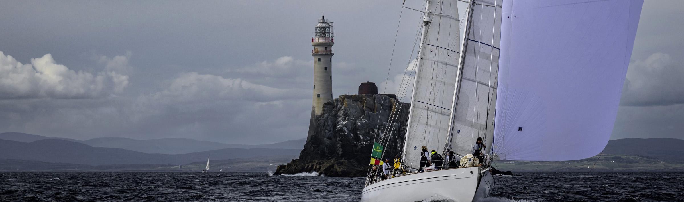 Stormvogel, the van der Stadt/Laurent Giles 74-footer, rounds the Fastnet Rock© ROLEX/Kurt Arrigo