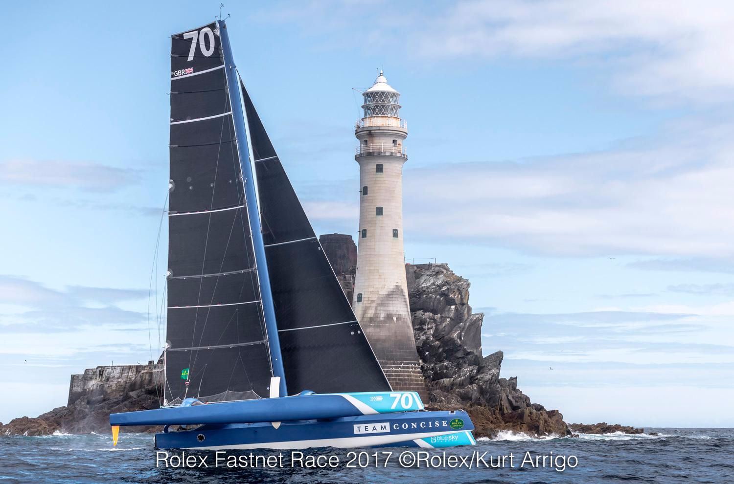 First around the Fastnet Rock and Multihull Line Honours for Tony Lawson's MOD70 Concise 10 © Rolex/Kurt Arrigo