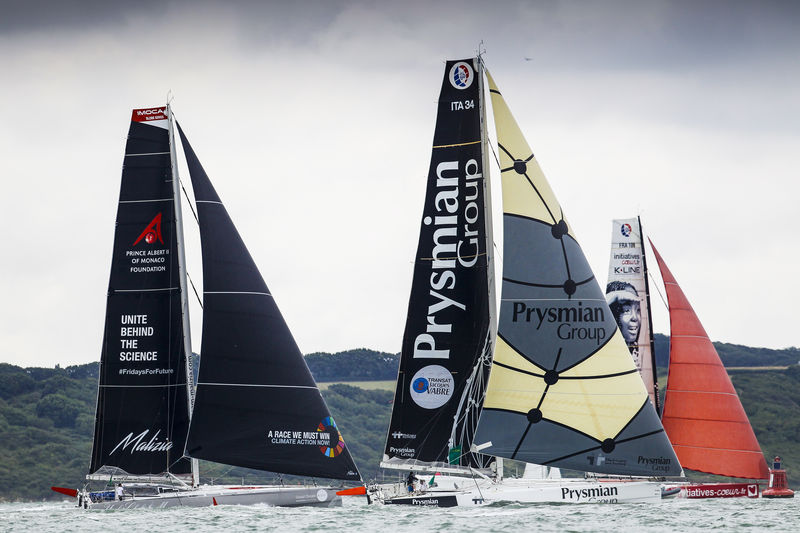 Giancarlo Pedote's Prysmian Group, Sam Davies and Paul Meilhat's Initiatives Couer and Boris Herrmann's Malizia - Yacht Club de Monaco cruise past the shoreline at the start of the Rolex Fastnet Race © Paul Wyeth/www.pwpictures.com