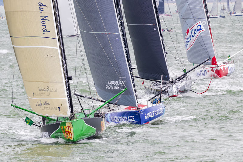 V and B, Banque Populaire, Charal and Maitre Coq - the distinctive IMOCA 60 silhouettes plough through the Solent at the start of the Rolex Fastnet Race © Carlo Borlenghi/Rolex