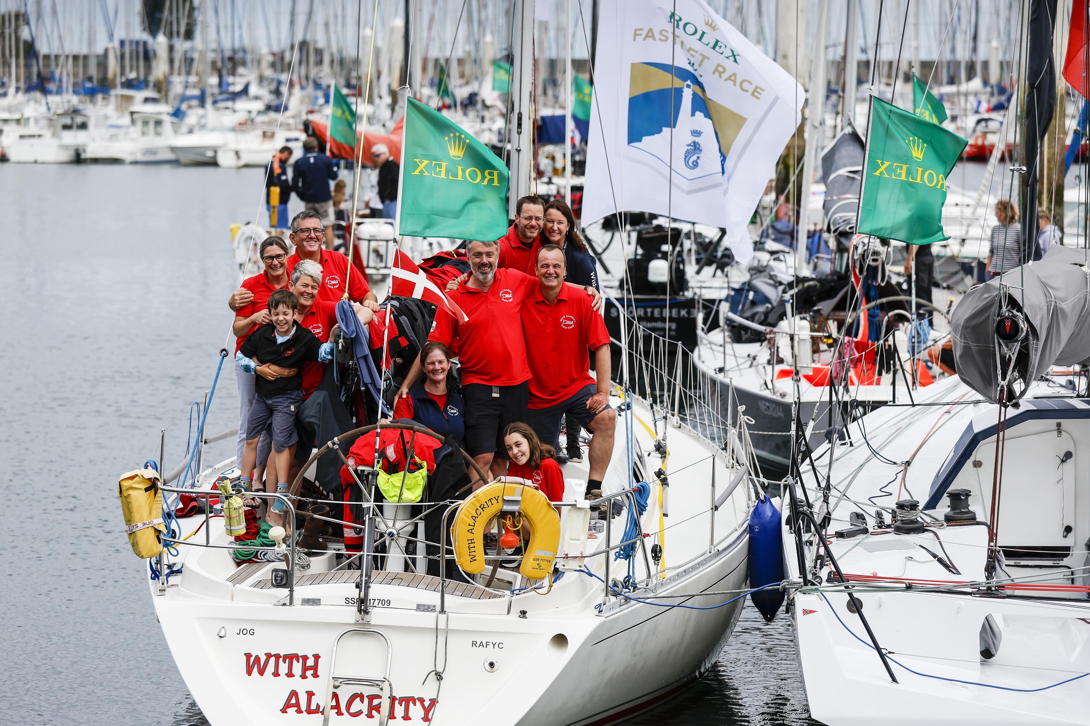 With Alacrity's crew, friends and family pile on for a celebratory photo at the end of another memorable race © Paul Wyeth/www.pwpictures.com