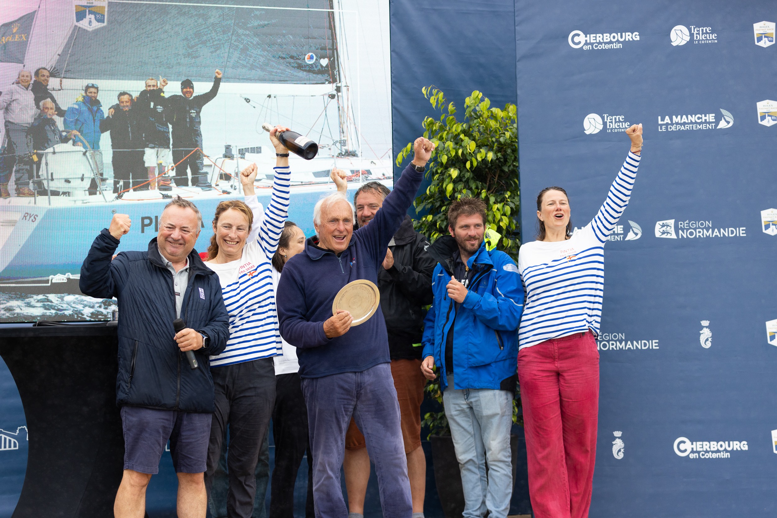 Gilles Fournier and his crew are awarded the trophy for winning IRC One by RORC Commodore James Neville © Arthur Daniel/RORC