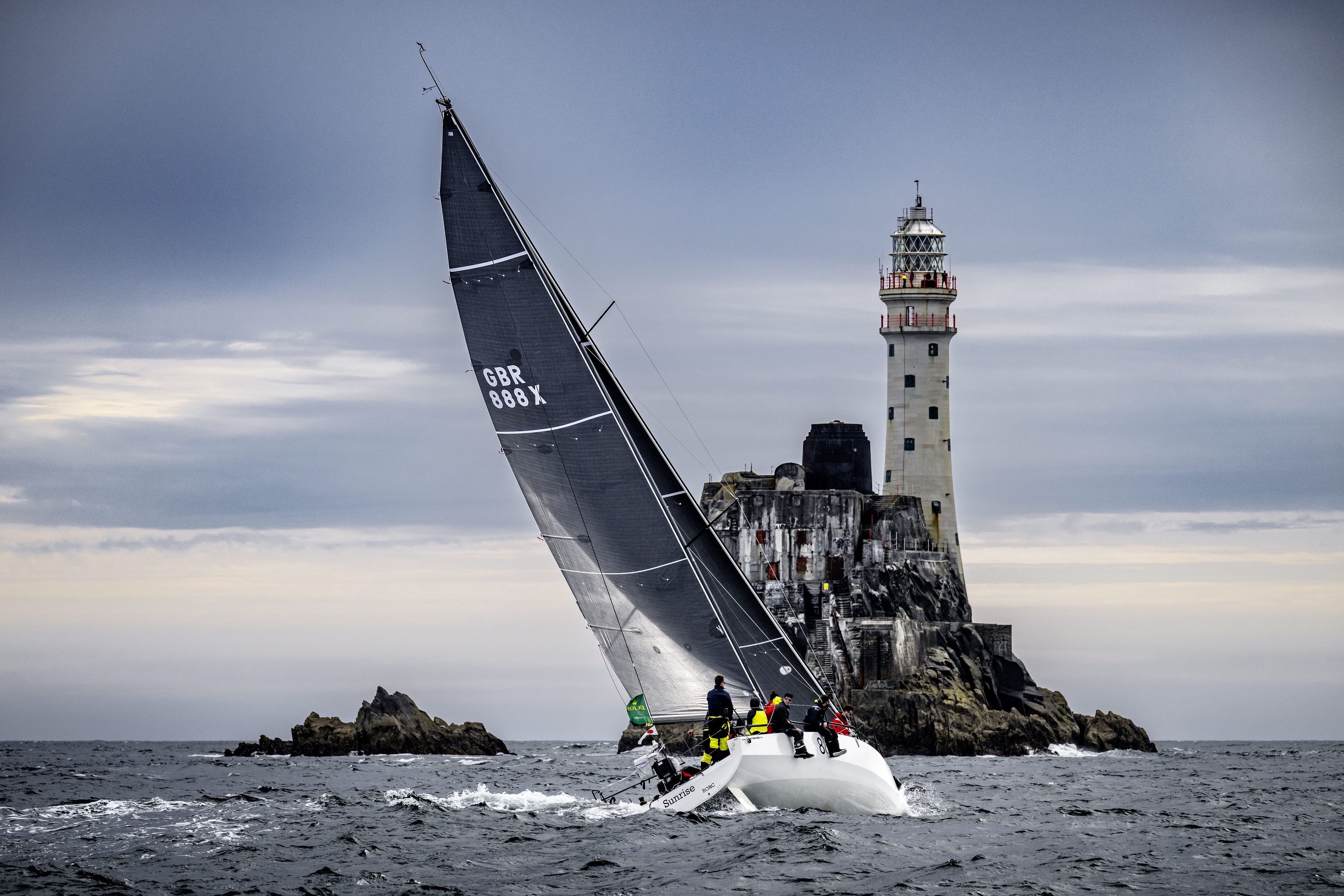 Thomas Kneen's JPK 1180 Sunrise III rounding the Fastnet Rock © ROLEX/Kurt Arrigo