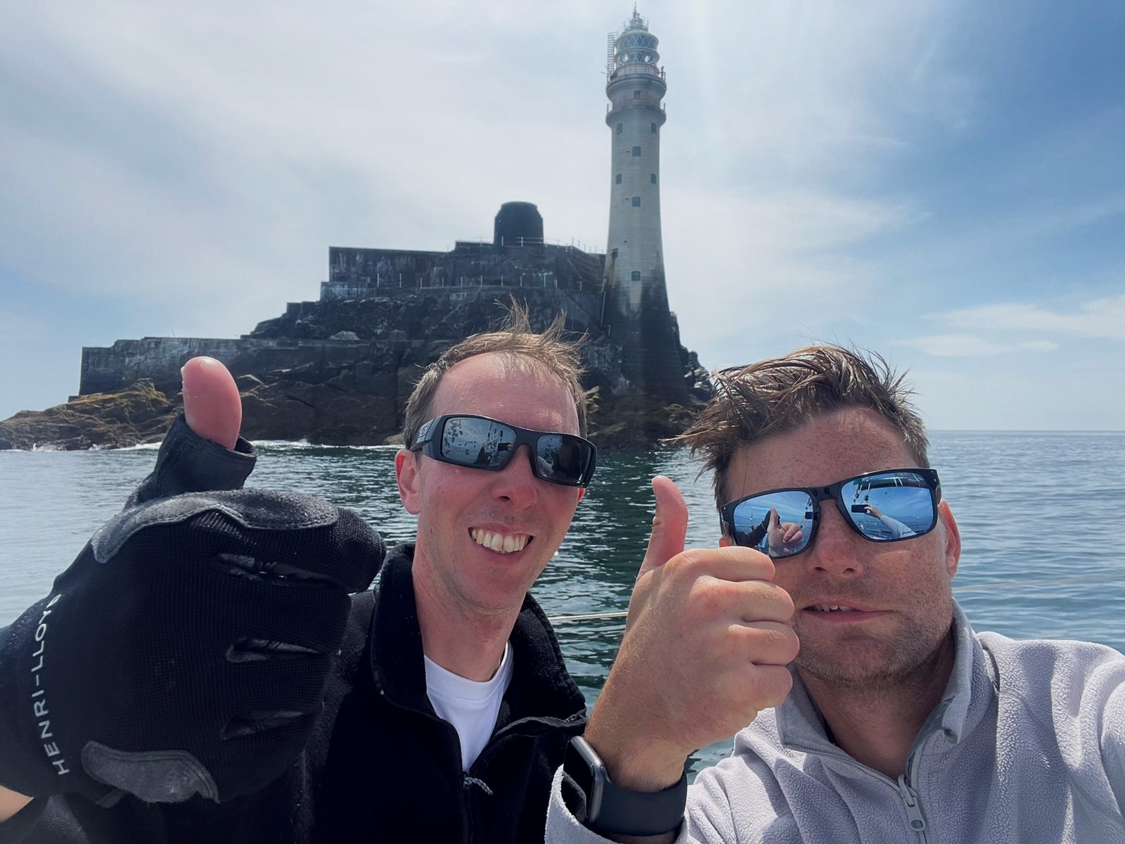 The Fastnet Rock makes the perfect backdrop for a quick selfie on board Cora, sailed by Tim Goodhew and Kelvin Matthews © Tim Goodhew