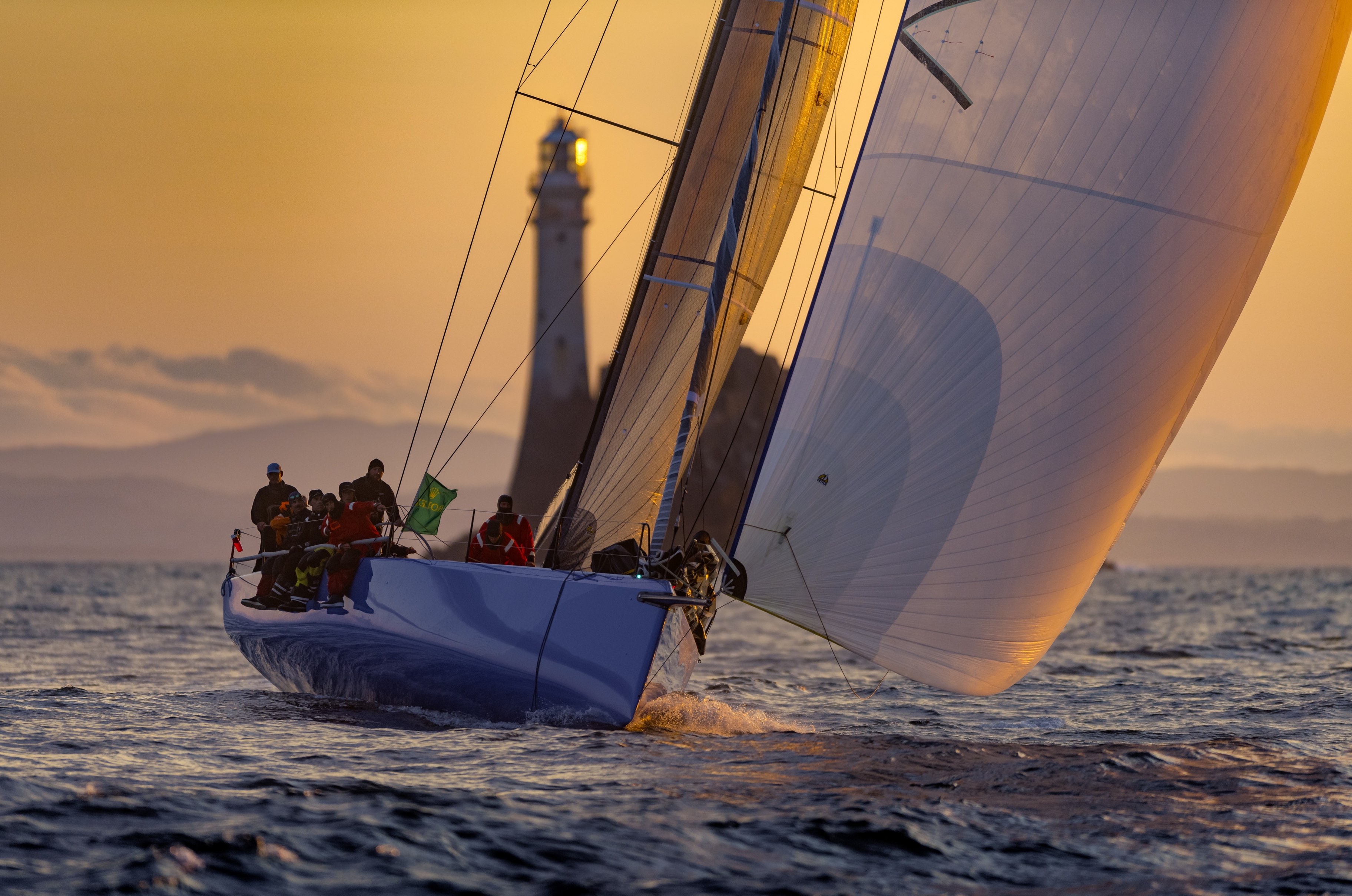 Chris Sheehan's PAC 52 Warrior Won rounds the Fastnet Rock © ROLEX/Kurt Arrigo