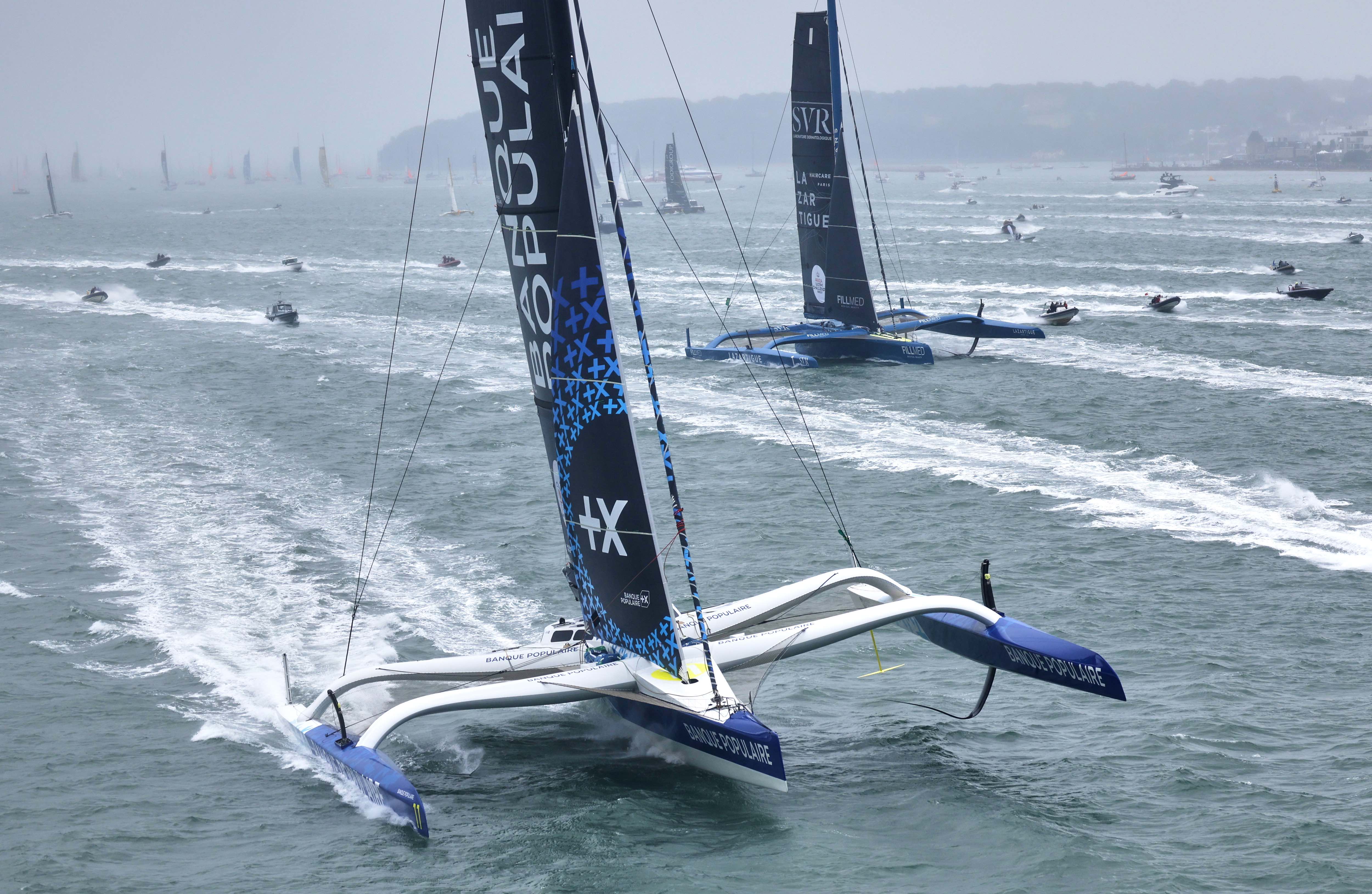 The Ultim trimarans lead the 50th Rolex Fastnet Race away © ROLEX/ Carlo Borlenghi